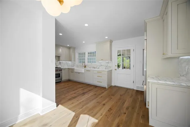 a view of a kitchen with wooden floor