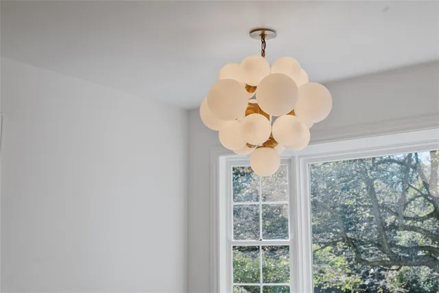 a view of a chandelier fan in a room