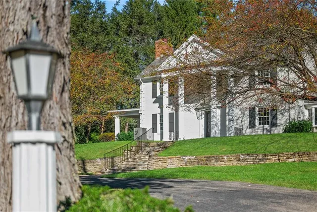 a front view of a house with garden