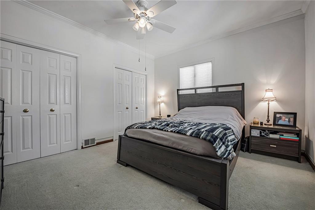 210 Grant Street North Huntingdon, PA 15642 - Photo 11 of 18 a bedroom with a bed and a lamp