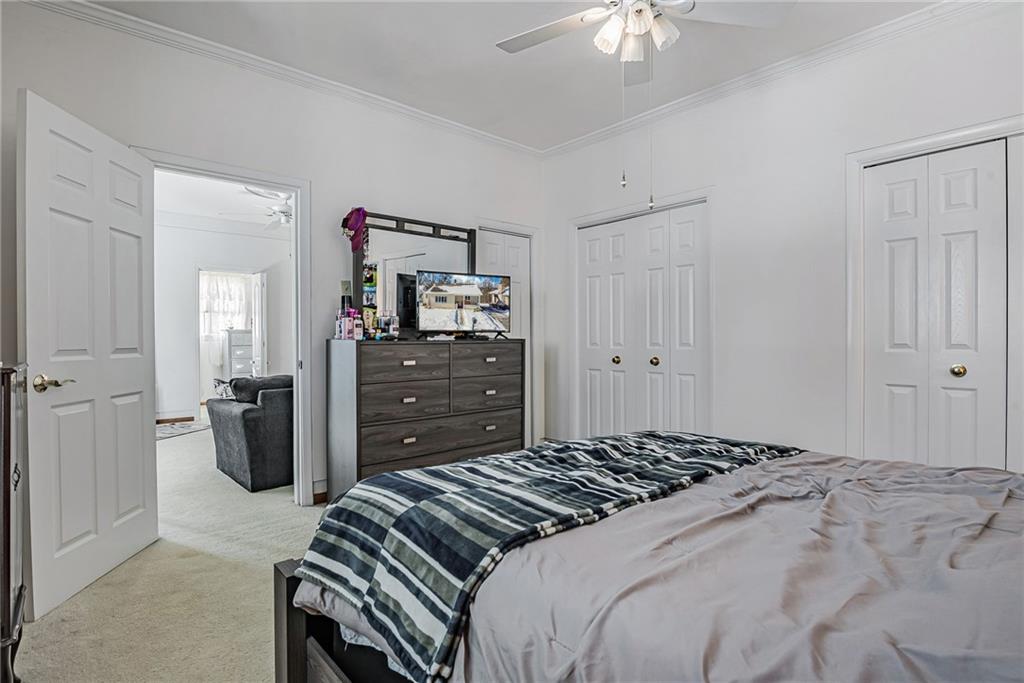 210 Grant Street North Huntingdon, PA 15642 - Photo 12 of 18 a bedroom with a bed and a chandelier