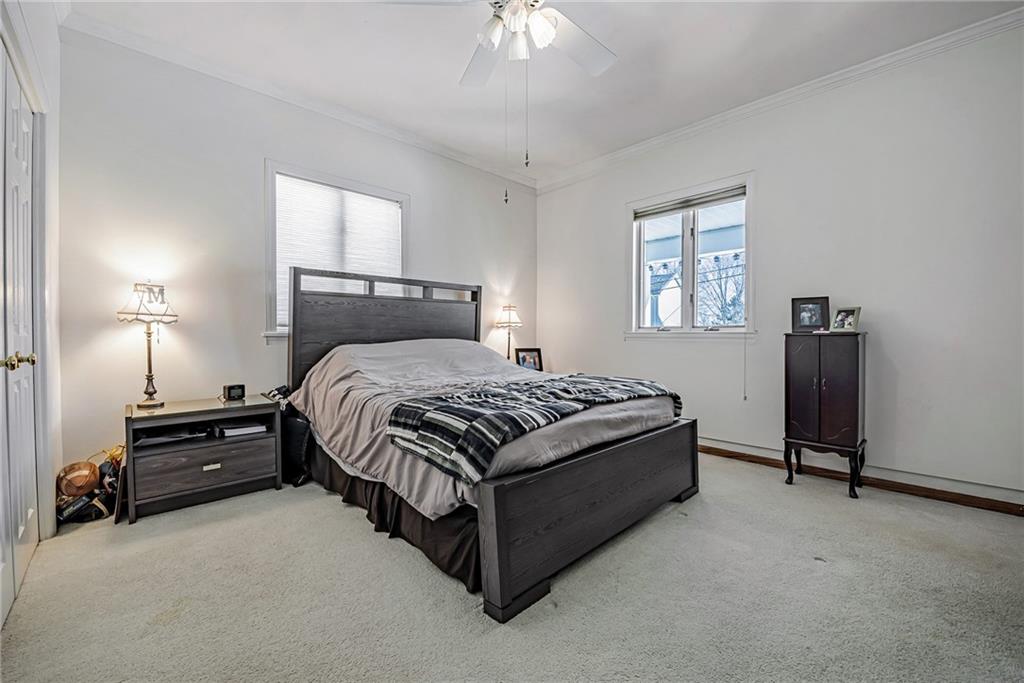 210 Grant Street North Huntingdon, PA 15642 - Photo 13 of 18 a bedroom with a bed and a chandelier