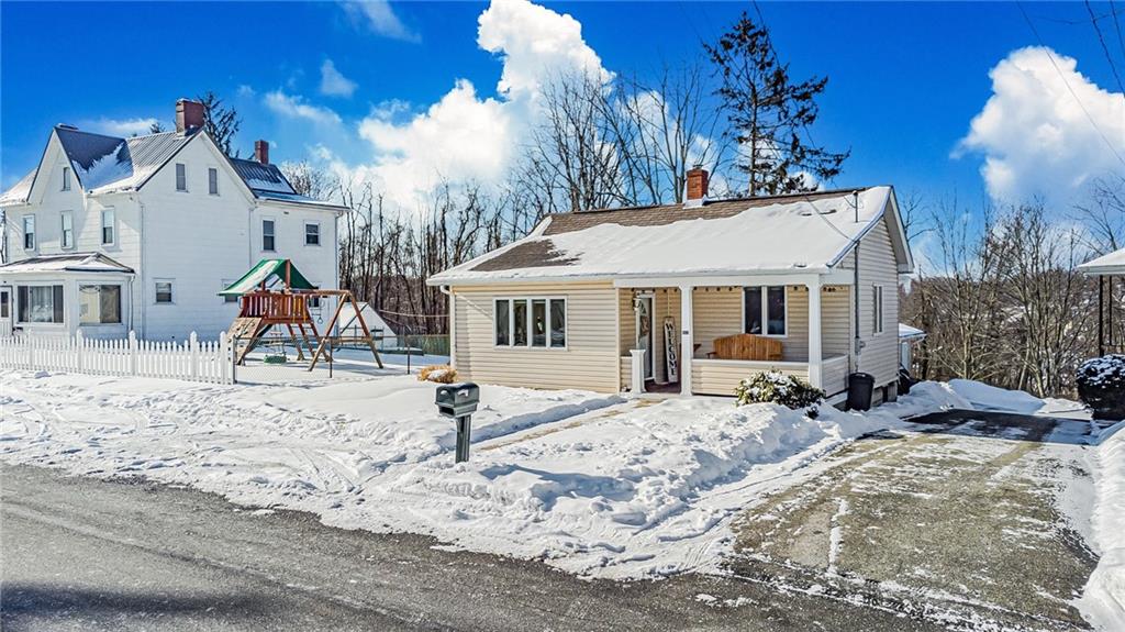 210 Grant Street North Huntingdon, PA 15642 - Photo 2 of 18 a front view of a house with a yard