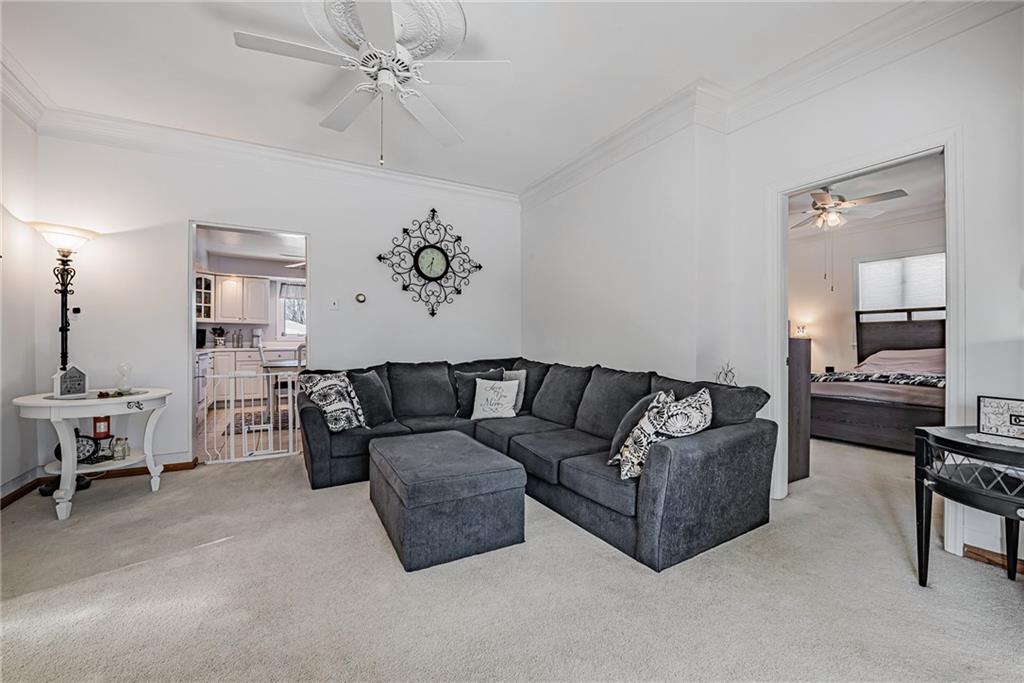 210 Grant Street North Huntingdon, PA 15642 - Photo 7 of 18 a living room with furniture and a flat screen tv