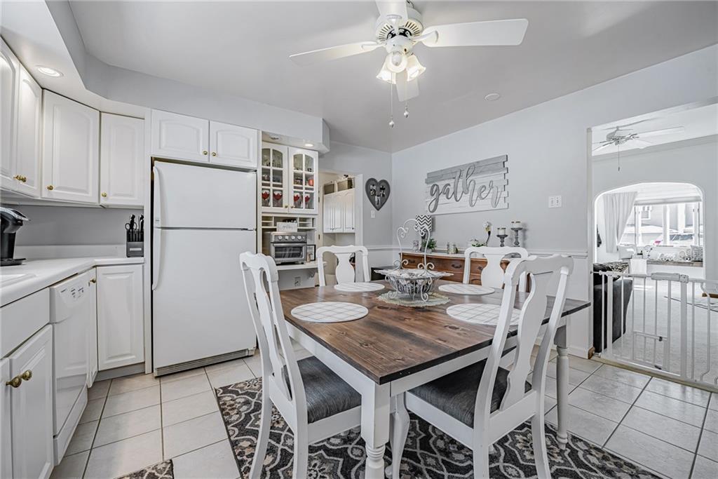 210 Grant Street North Huntingdon, PA 15642 - Photo 10 of 18 a kitchen with stainless steel appliances granite countertop a dining table and chairs