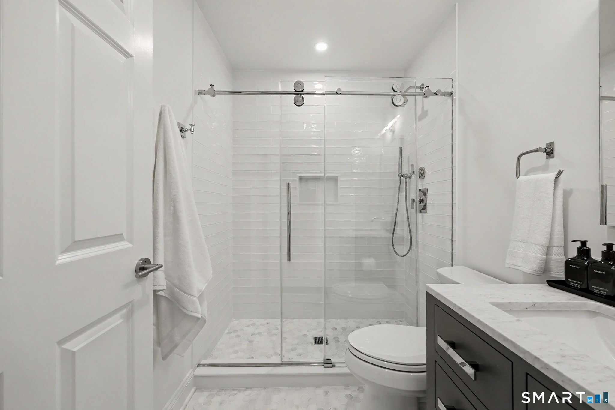 10 Side Hill Road Westport, CT 06880 - Photo 28 of 40 a bathroom with a granite countertop sink toilet and shower