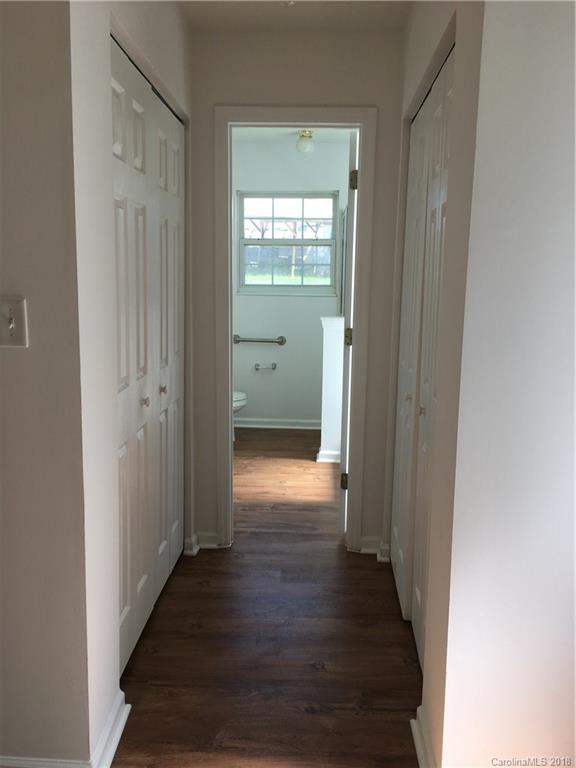 4306 Lothar Ridge Lane Charlotte, NC 28216 - Photo 11 of 22 a view of a hallway with wooden floor