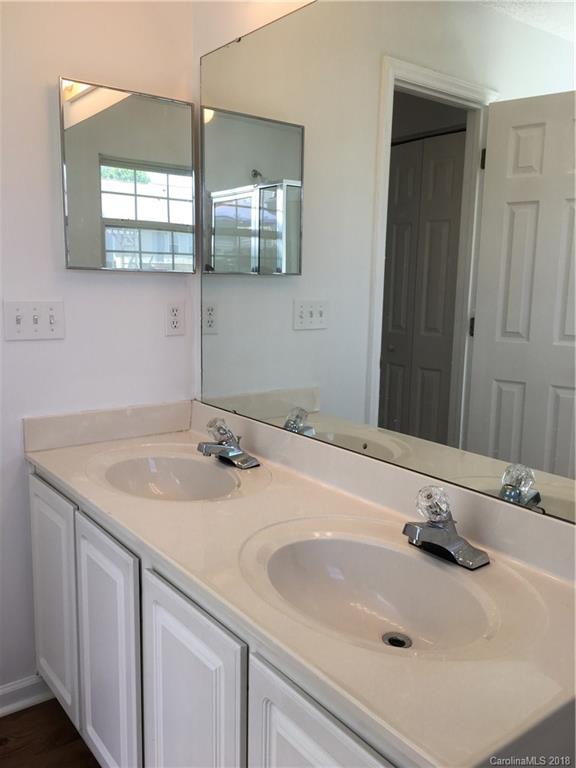 4306 Lothar Ridge Lane Charlotte, NC 28216 - Photo 13 of 22 a bathroom with a sink and a mirror