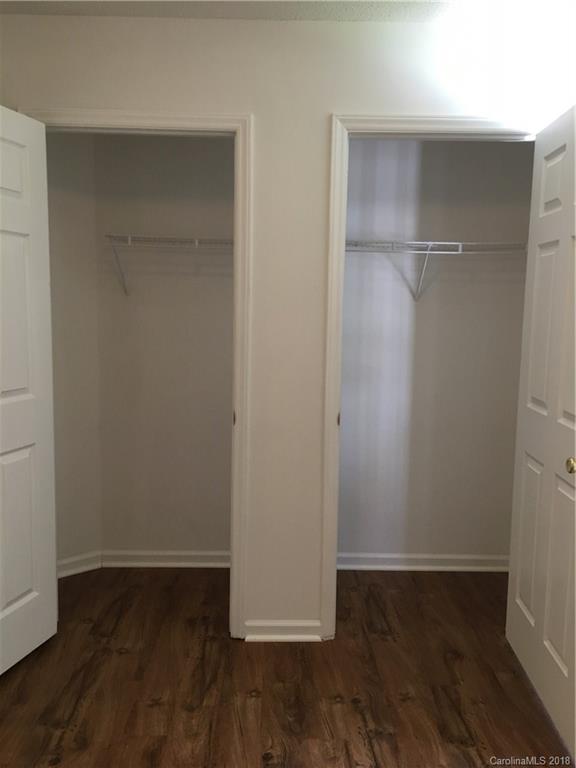 4306 Lothar Ridge Lane Charlotte, NC 28216 - Photo 15 of 22 an empty walk in closet with wooden floor