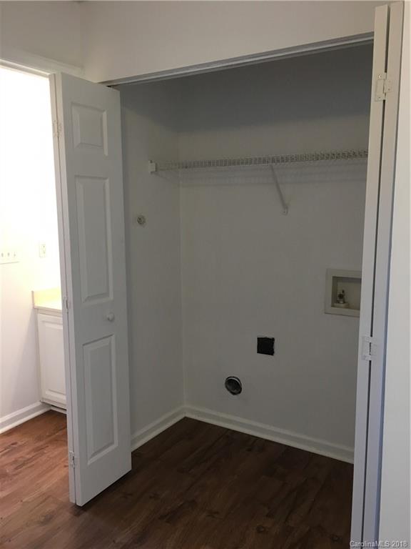 4306 Lothar Ridge Lane Charlotte, NC 28216 - Photo 19 of 22 an empty room with wooden floor and closet
