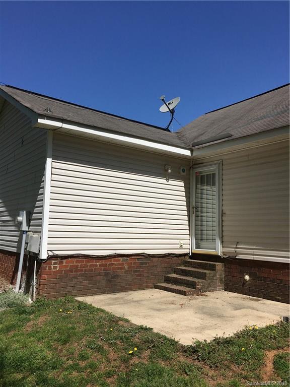 4306 Lothar Ridge Lane Charlotte, NC 28216 - Photo 20 of 22 a view of house with backyard and garage