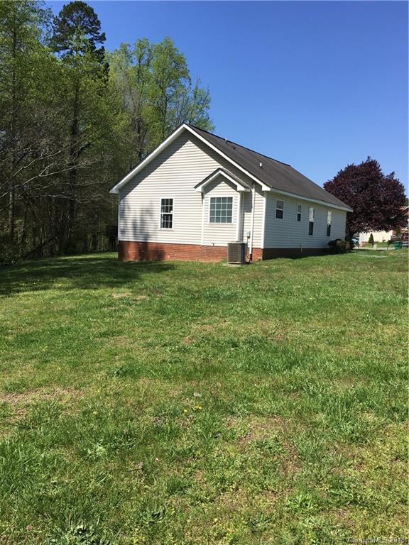 4306 Lothar Ridge Lane Charlotte, NC 28216 - Photo 21 of 22 a view of a house with a yard
