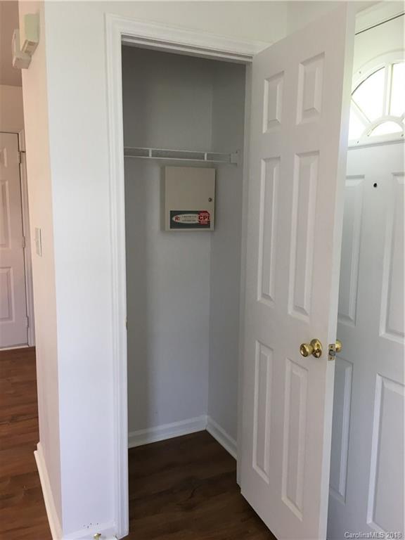 4306 Lothar Ridge Lane Charlotte, NC 28216 - Photo 7 of 22 a view of a hallway with wooden floor