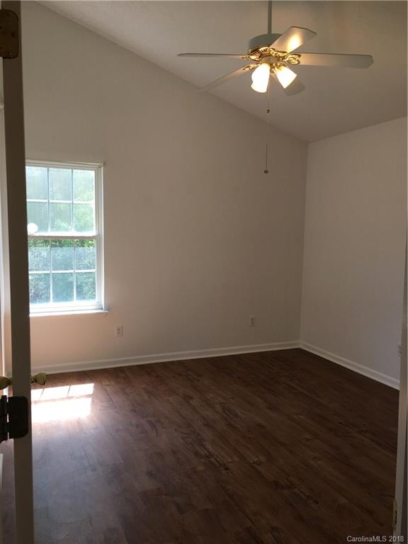 4306 Lothar Ridge Lane Charlotte, NC 28216 - Photo 10 of 22 a view of wooden floor and a chandelier in a room