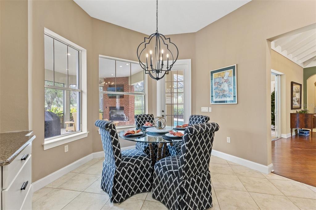 4978 Southern Valley Loop Brooksville, FL 34601 - Photo 12 of 78 a view of a dining room with furniture window and outside view