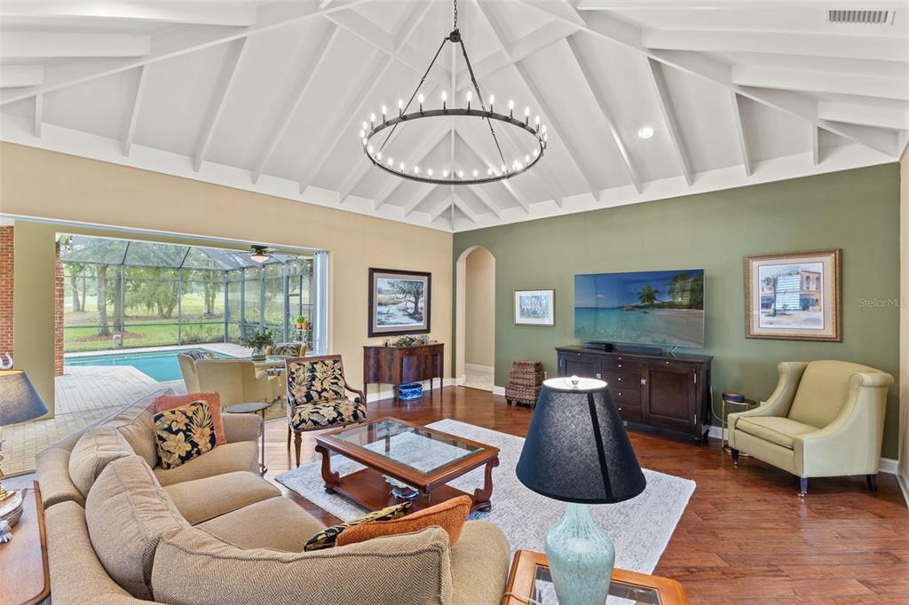 4978 Southern Valley Loop Brooksville, FL 34601 - Photo 24 of 78 a living room with furniture a table and a large window