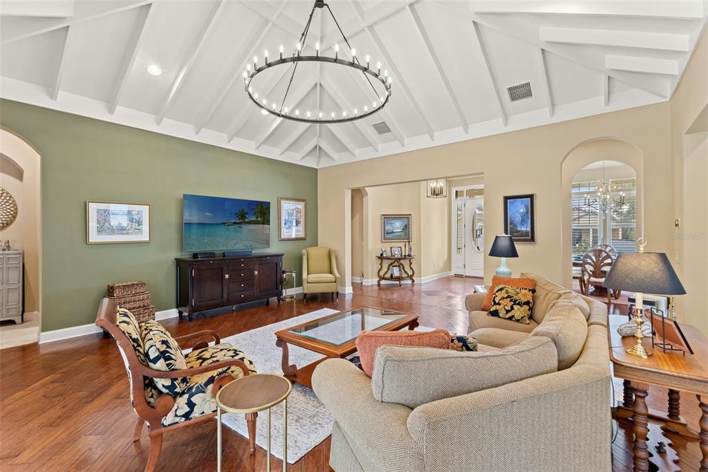 4978 Southern Valley Loop Brooksville, FL 34601 - Photo 25 of 78 a living room with furniture a dining table and a chandelier