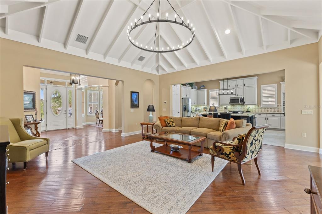 4978 Southern Valley Loop Brooksville, FL 34601 - Photo 3 of 78 a living room with furniture a rug and white walls