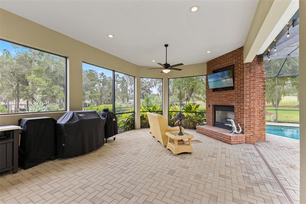 4978 Southern Valley Loop Brooksville, FL 34601 - Photo 40 of 78 a living room with furniture and a fireplace