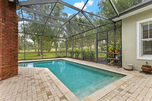 an aerial view of a house with a lake view