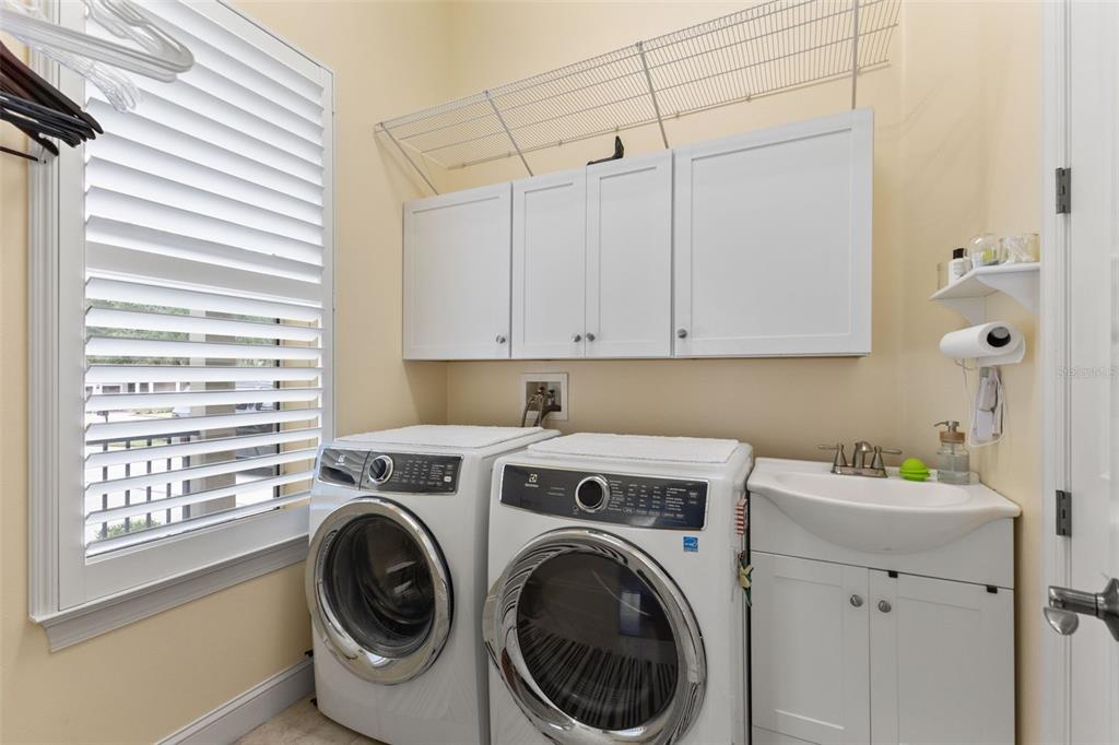 4978 Southern Valley Loop Brooksville, FL 34601 - Photo 45 of 78 a utility room with dryer and washer