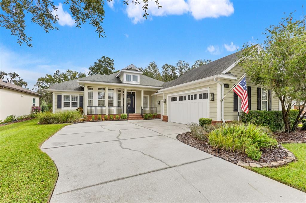 4978 Southern Valley Loop Brooksville, FL 34601 - Photo 51 of 78 a view of a white house with a yard