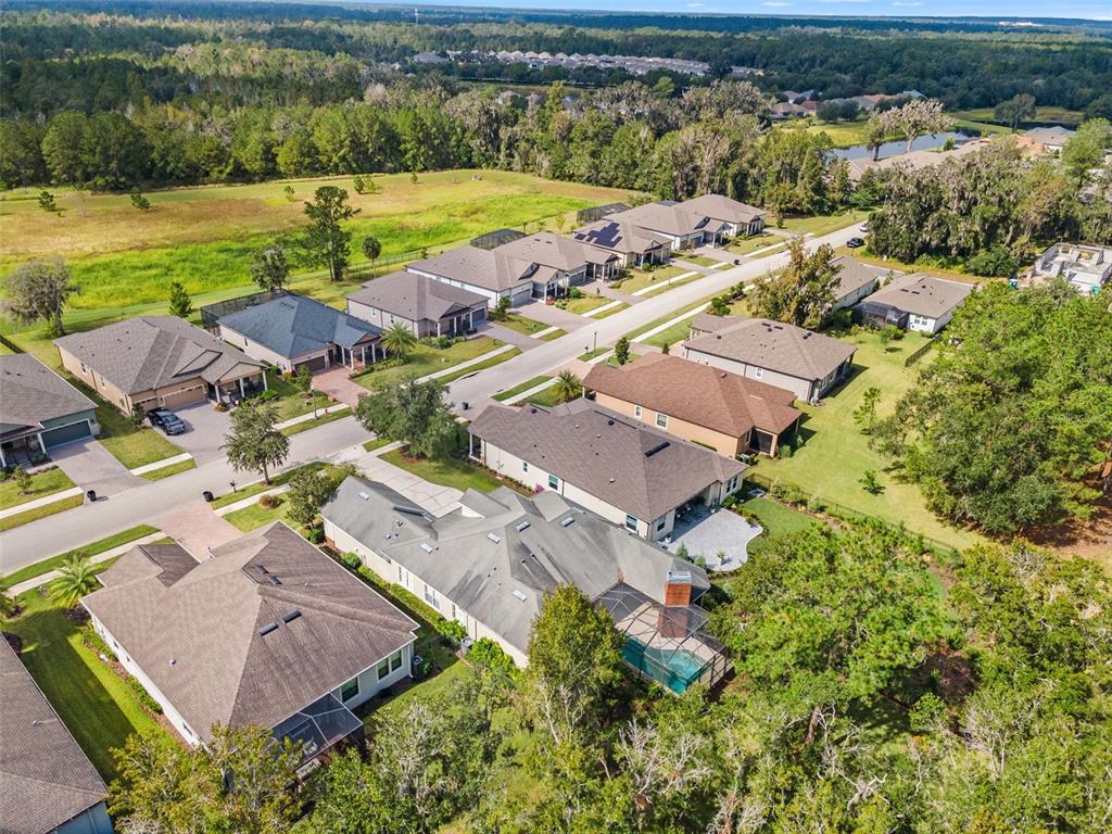 4978 Southern Valley Loop Brooksville, FL 34601 - Photo 54 of 78 an aerial view of a house with a lake view