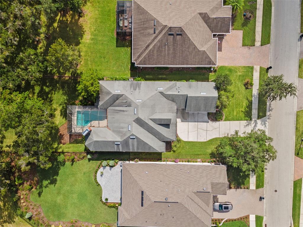 4978 Southern Valley Loop Brooksville, FL 34601 - Photo 56 of 78 an aerial view of a house with a garden