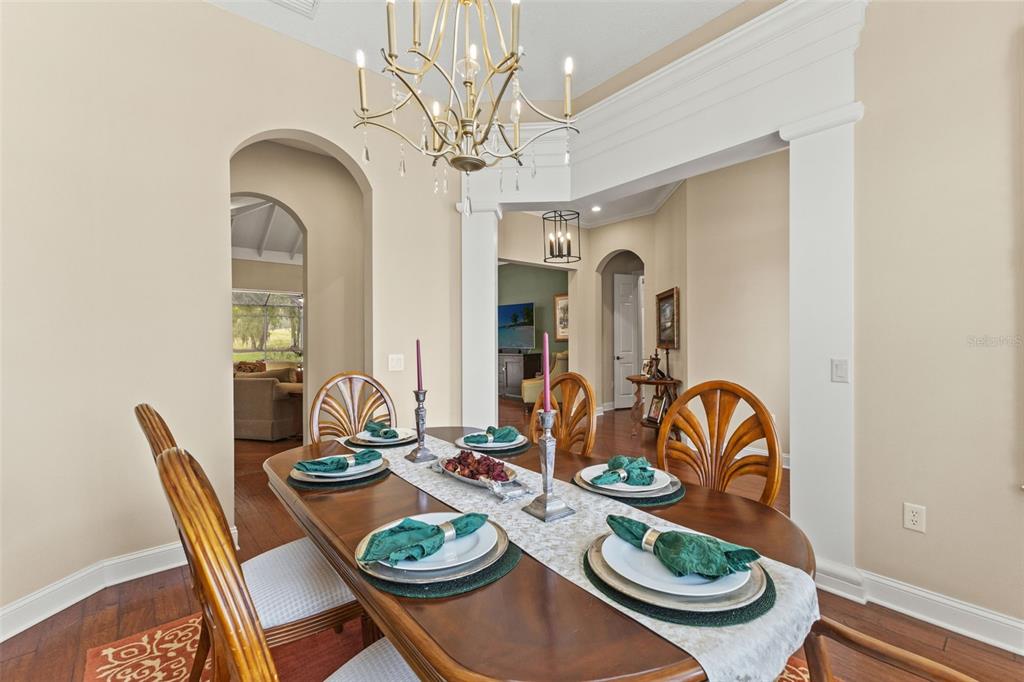 4978 Southern Valley Loop Brooksville, FL 34601 - Photo 8 of 78 a view of a dining room with furniture and chandelier