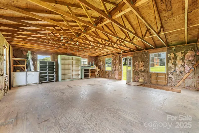 a view of large room with wooden walls