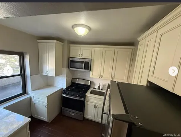 a kitchen with a stove and a refrigerator
