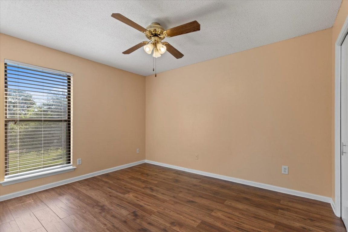 10616 Mellow Meadow Drive, Unit 21C Austin, TX 78750 - Photo 20 of 39 a view of a big room with wooden floor and windows
