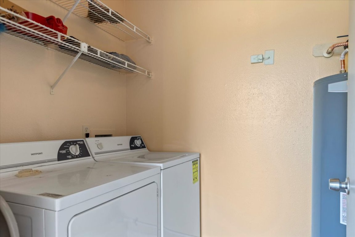 10616 Mellow Meadow Drive, Unit 21C Austin, TX 78750 - Photo 24 of 39 a utility room with dryer and washer