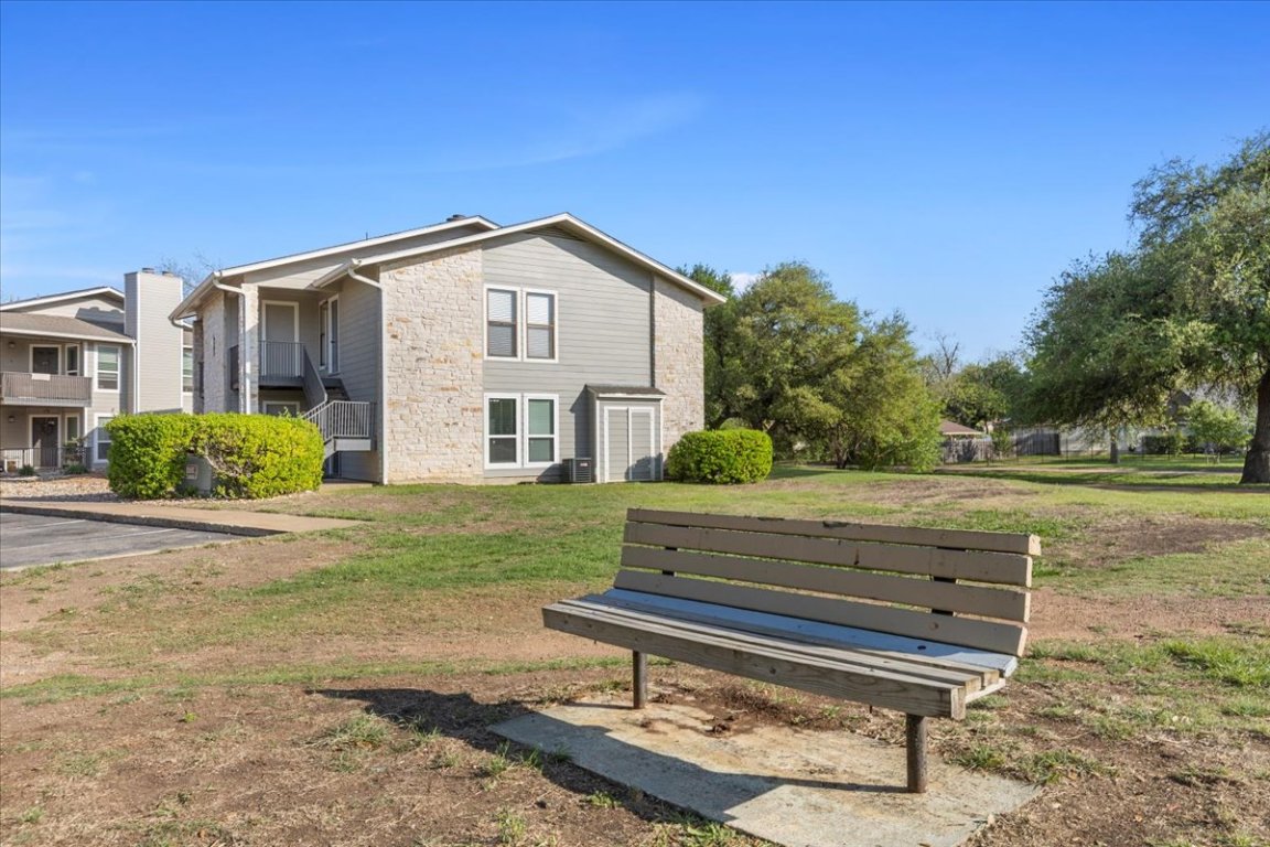 10616 Mellow Meadow Drive, Unit 21C Austin, TX 78750 - Photo 27 of 39 a view of a house with a yard