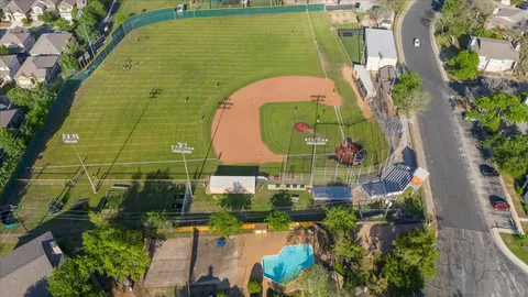 an aerial view of a house with swimming pool