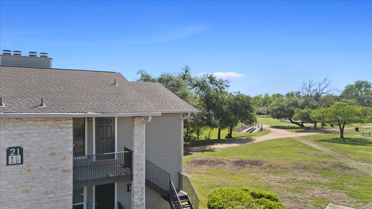 10616 Mellow Meadow Drive, Unit 21C Austin, TX 78750 - Photo 4 of 39 a view of a house with a yard