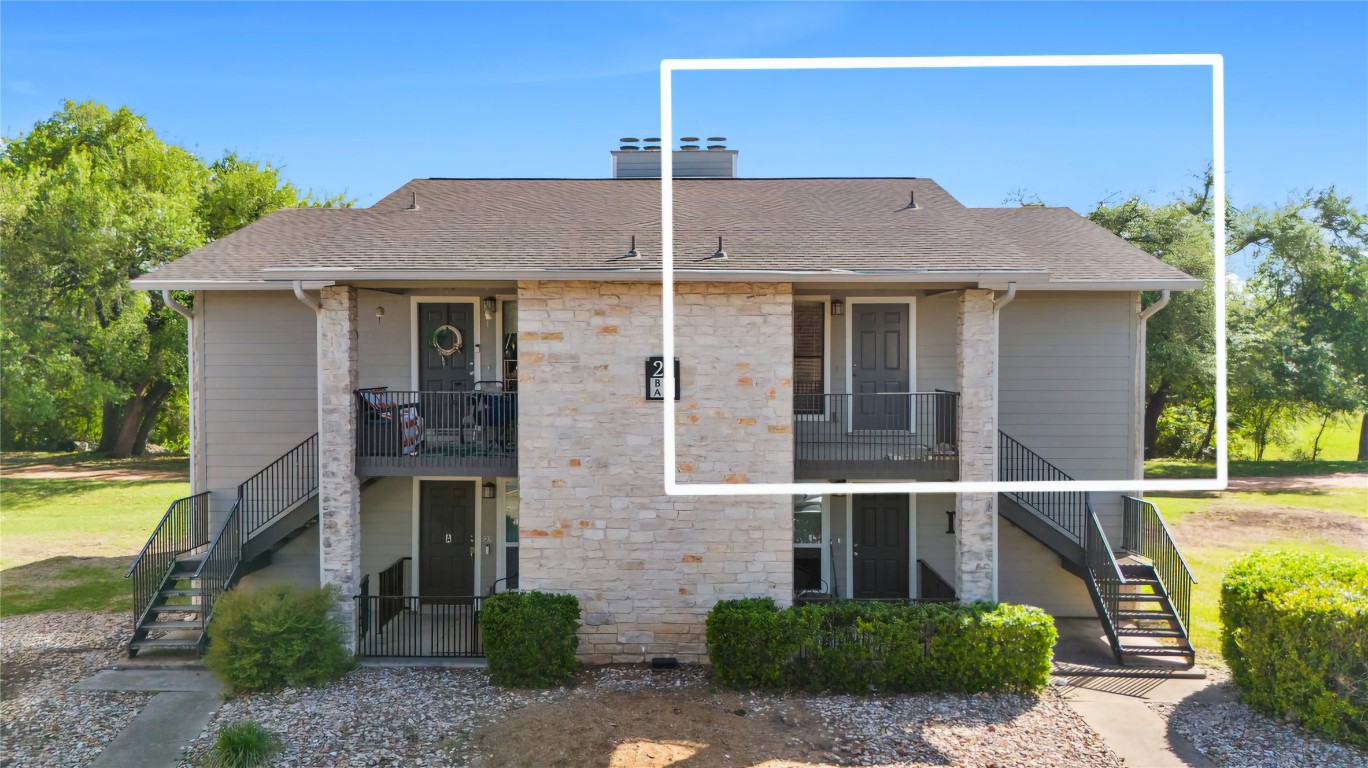 10616 Mellow Meadow Drive, Unit 21C Austin, TX 78750 - Photo 5 of 39 a front view of a house with a yard