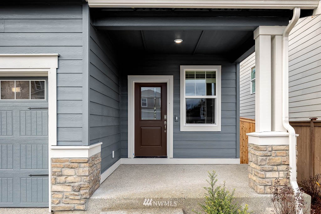 2 180th Place Southeast, Unit 36 Bothell, WA 98012 - Photo 2 of 40 a front view of a house with a garage