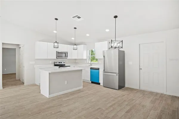a view of a kitchen with a sink