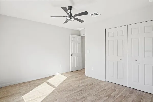 an empty room with window and windows