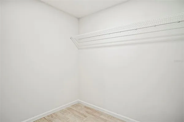 a view of a yard with swimming pool and green space