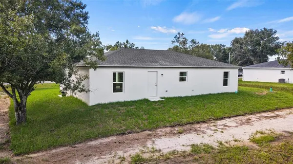 a view of a house with a big yard