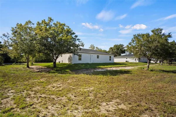 an aerial view of house with yard
