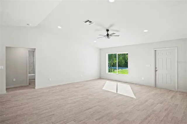 a view of an empty room with a window