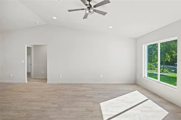 a view of an empty room with a window
