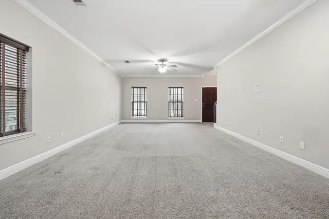 a bathroom with a granite countertop sink a toilet and a mirror