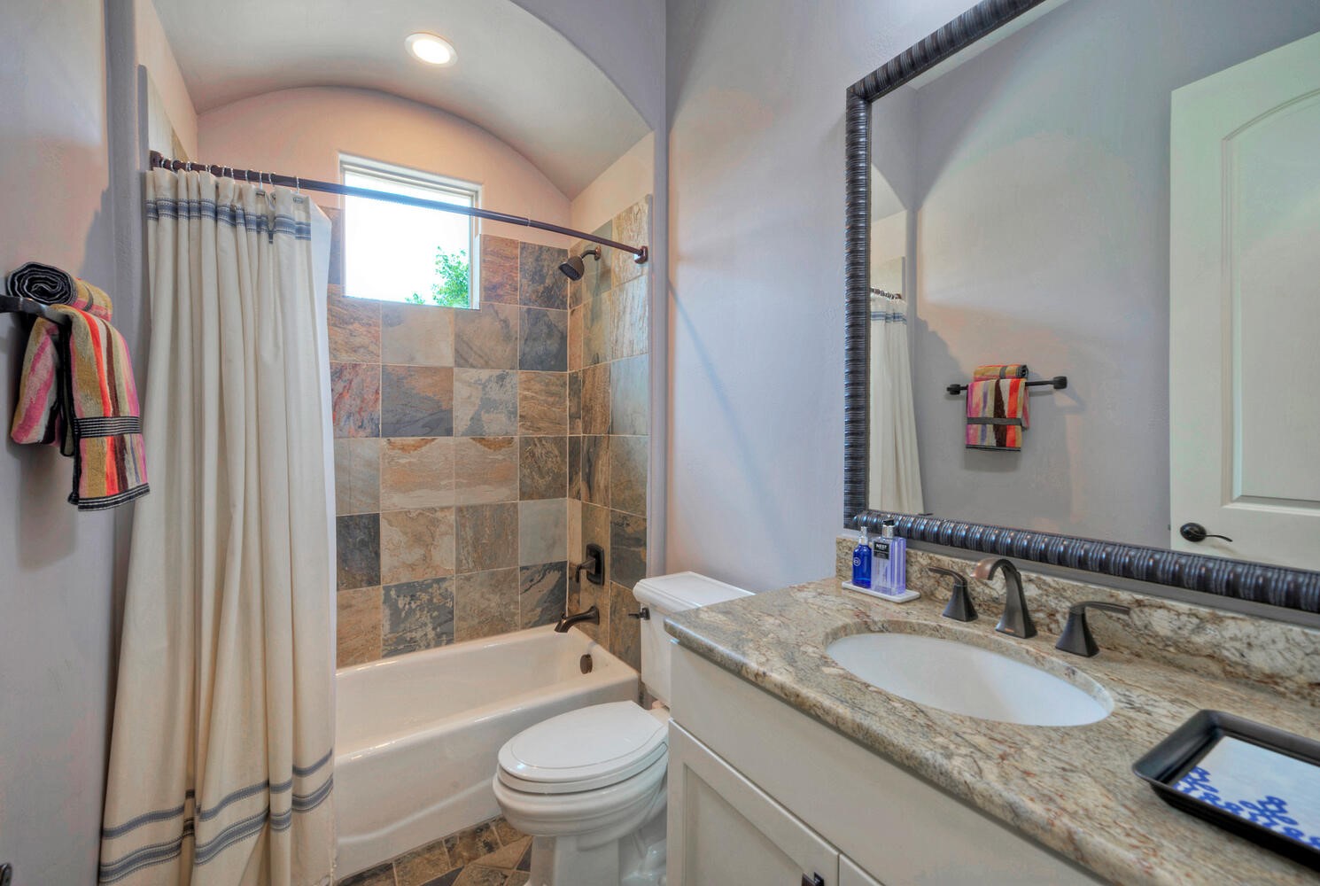 7 Parkside Road The Hills, TX 78738 - Photo 22 of 36 Full bath off the office/bedroom on the main level.