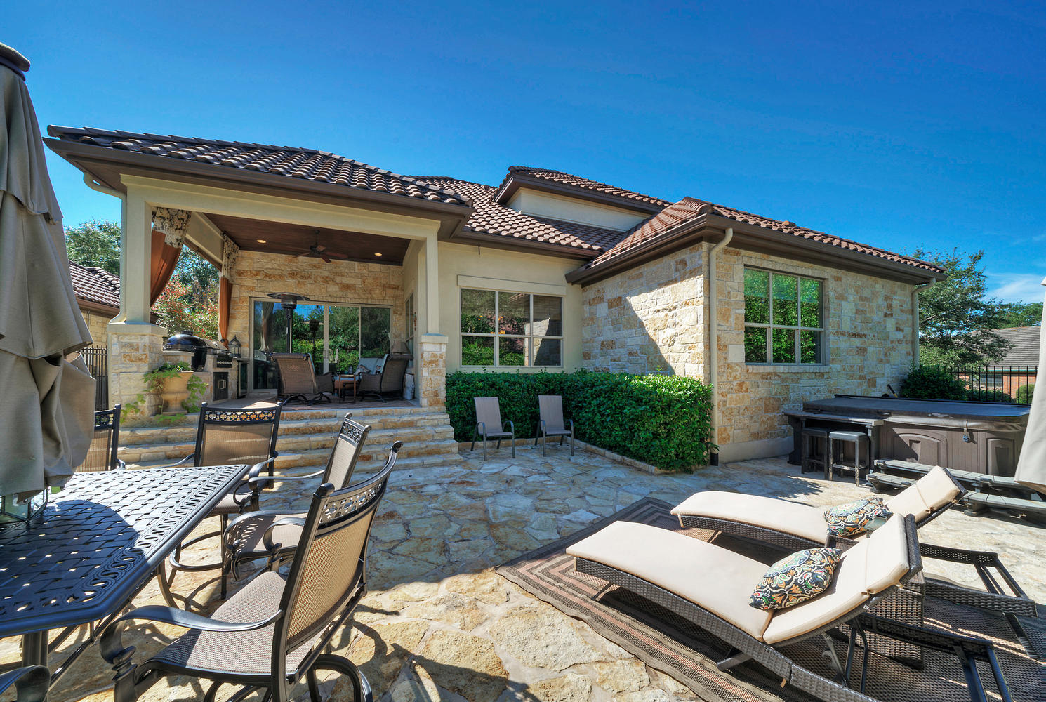 7 Parkside Road The Hills, TX 78738 - Photo 34 of 36 View of patio with outdoor dining space, ceiling fan, and a hot tub