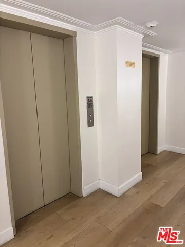 a room with a table and potted plants