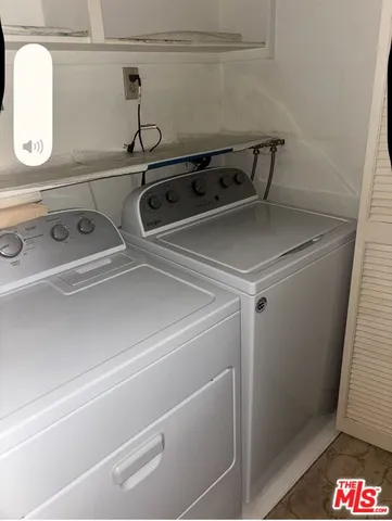 a bathroom with a sink and mirror with toilet